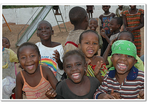 Children from a community school taking a break to play.